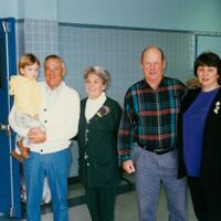Four adults and one child in school. 