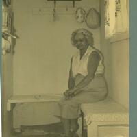 an older Finnish woman sits in a sauna