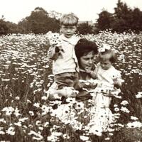 Leo Bock’s wife, Lillian Bock and their two children, Walter and Marie in a field of daisies in Lynbrook, NY. Circa 1912. 