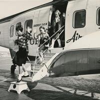 A librarian and children alighting from a helicopter trip (LPP.103).