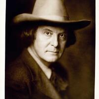 Portrait of Roycroft founder Elbert Hubbard in iconic wide-brimmed Stetson hat with a scarf tied in a bow at his throat
