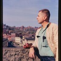 Photo of Gene Dauner looking at Rondout from the roof of the Cornell Building