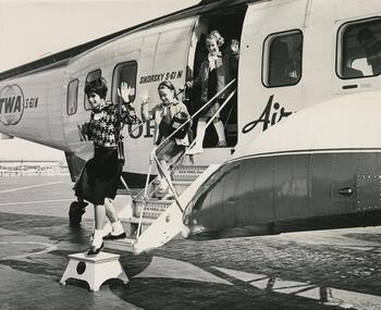 A librarian and children alighting from a helicopter trip (LPP.103).