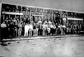Salt workers in front of cistern. 