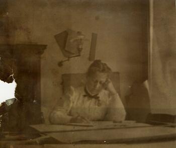 Photograph of woman working at desk