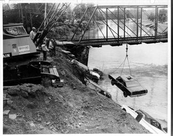 Stacking cars in the river to prevent erosion